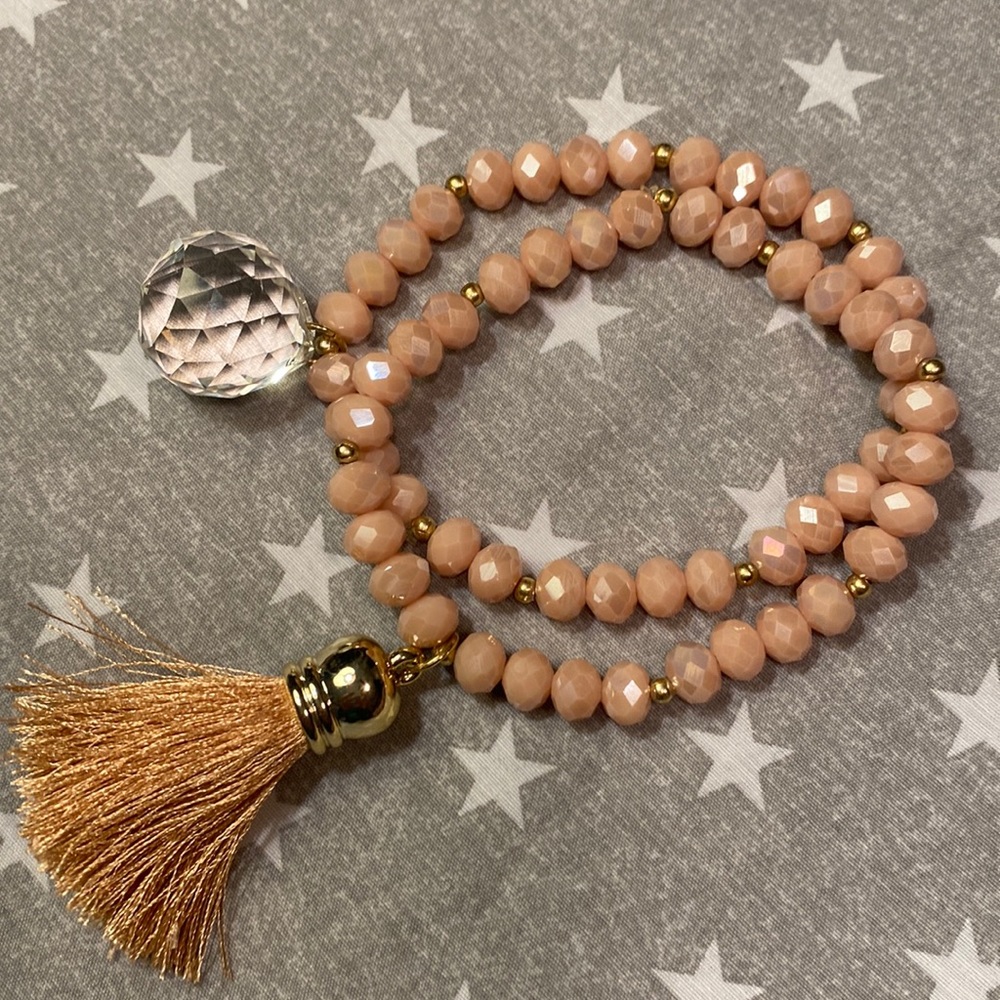 2 pink stretch bracelets w/ crystal and tassel